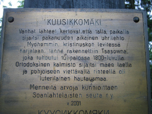 Teksti Kuusikkomäen ristinkilvessä.